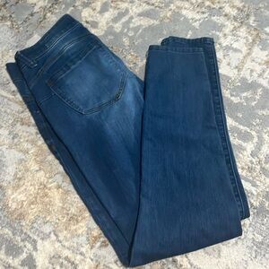 Gently worn jeans with light distress coloring